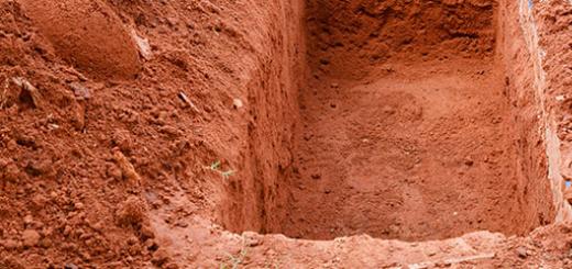 What should be the standard size of a grave in a cemetery?